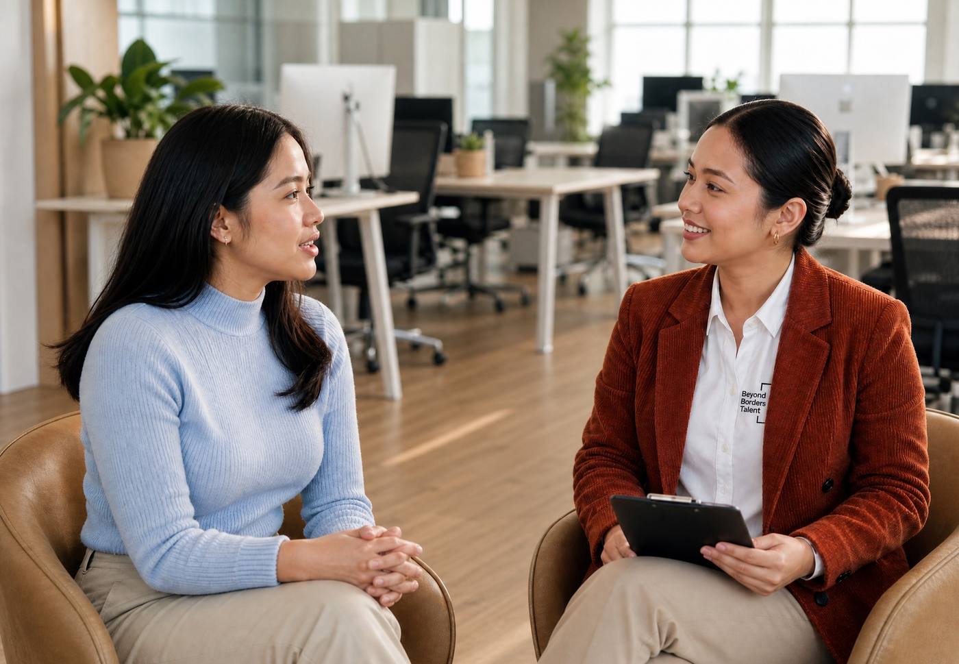 Two professionals discussing work in an office